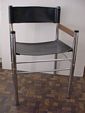 Mid Century Modern chrome and black naugahyde chair view 1